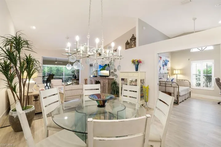 Dining space featuring lofted ceiling and light hardwood / wood-style floors