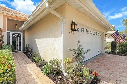 View of side of home with a garage