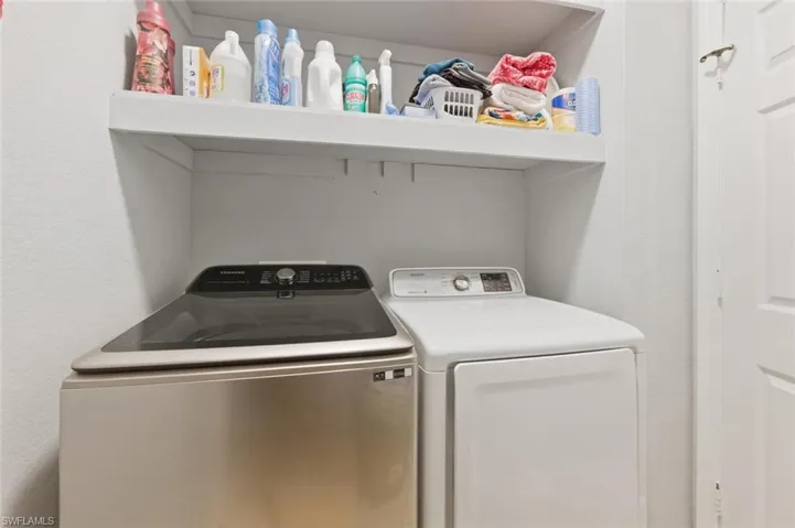 Laundry area with washing machine and clothes dryer