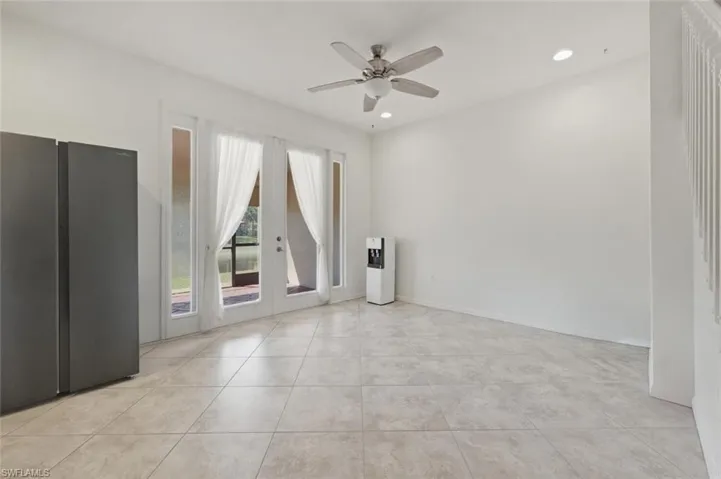 Unfurnished room featuring french doors, a ceiling fan, recessed lighting, and light tile patterned flooring