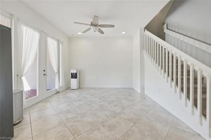 Unfurnished room featuring a ceiling fan, french doors, recessed lighting, and light tile patterned flooring