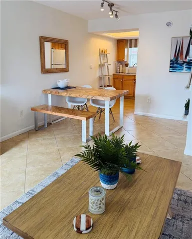 Tile flooring extends through the dining area into the kitchen