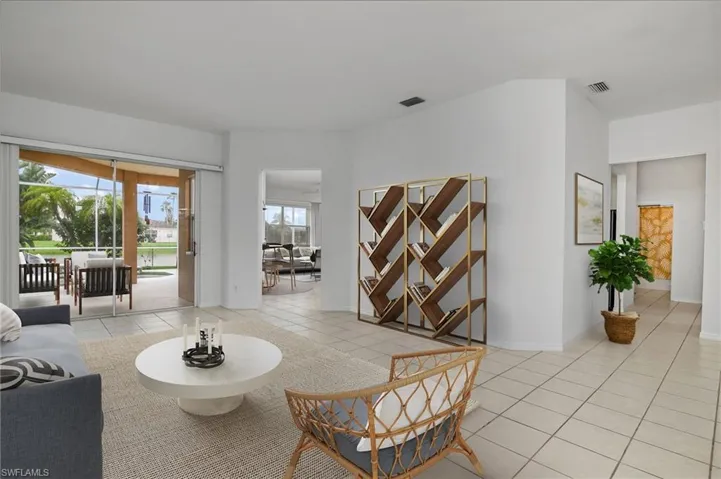 Living room featuring plenty of natural light and light tile patterned floors