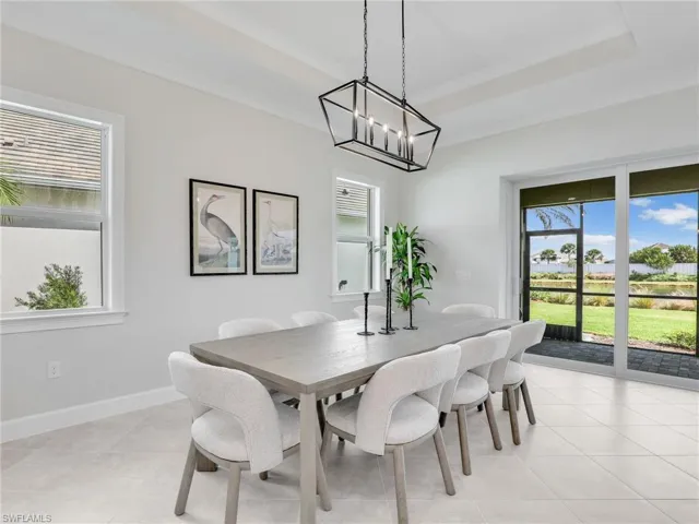 Dining space with a chandelier and ornamental molding