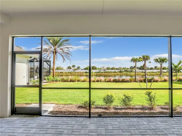 Unfurnished sunroom with a water view