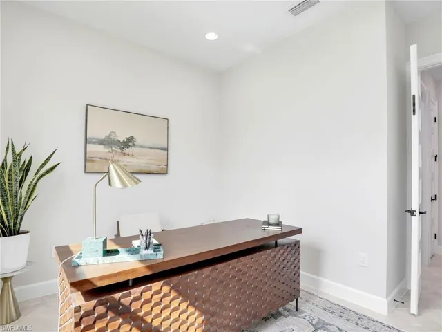 Home office with baseboards and recessed lighting