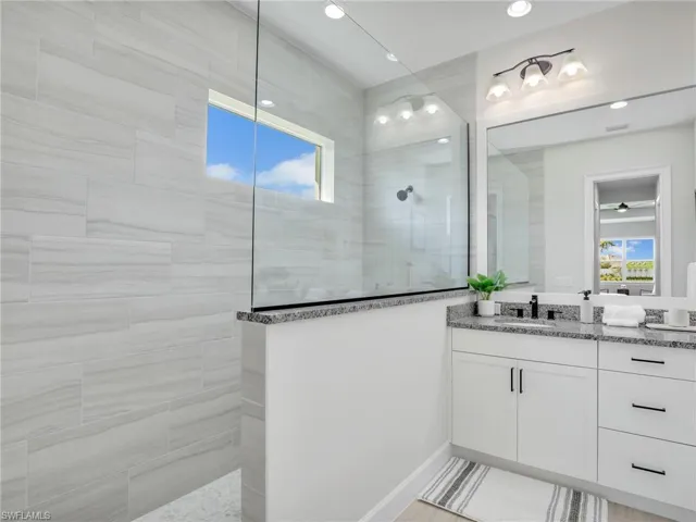 Bathroom featuring vanity and walk in shower