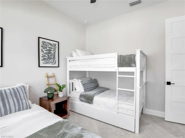 Bedroom featuring a ceiling fan and light tile patterned floors