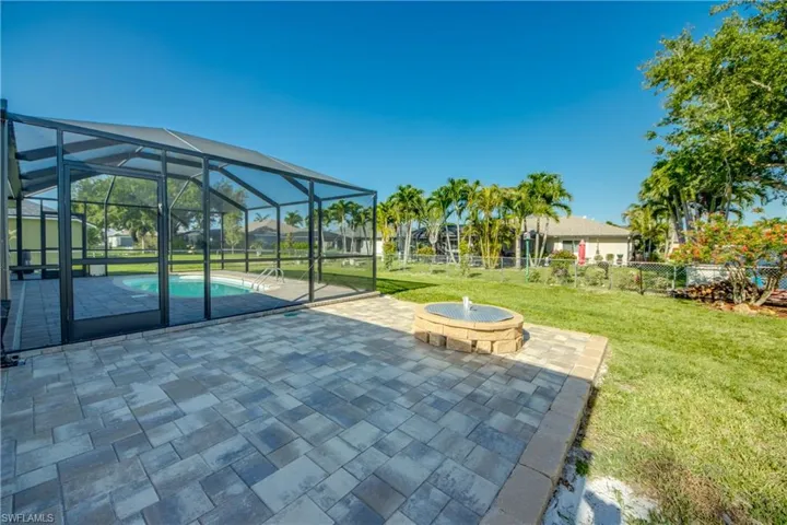 View of patio featuring an outdoor pool and a lanai