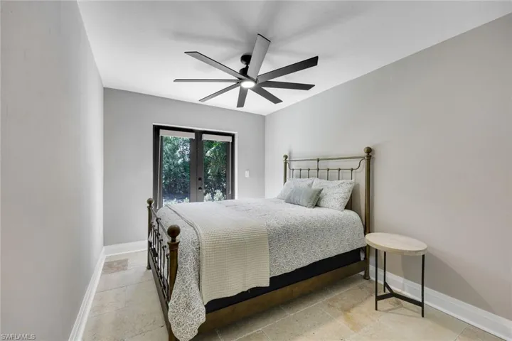 Second bedroom offers outdoor access.