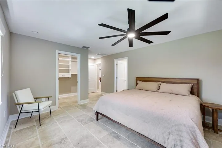 Primary bedroom features a large custom closet.