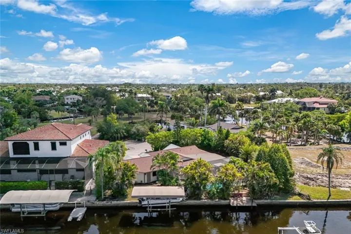 Property features a private dock AND a 10,000 pound COVERED boat lift.