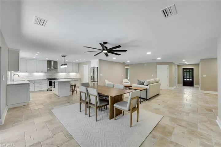 Living, kitchen and dining room are open to one another.