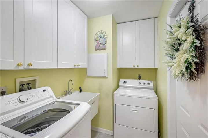 In-door laundry room with tub basin and ample storage. New Washer (2023)