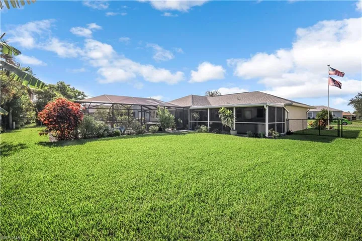 Beautiful well maintained yard with Lush tropical landscaping.