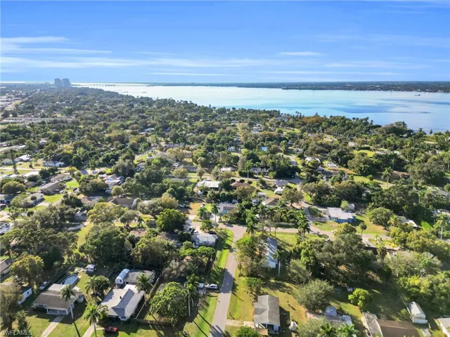 View of property location with nearby suburban area and a large body of water