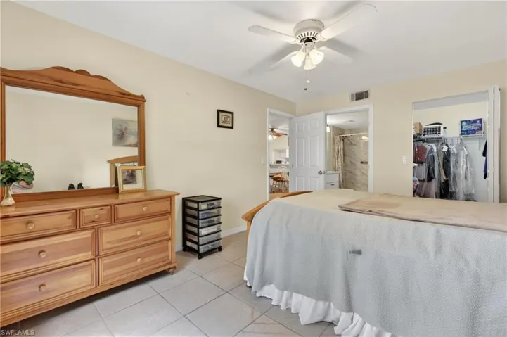 Tiled flooring throughout with ceiling fan, providing a functional and adaptable living space