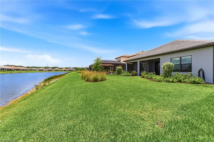 Semi-private back yard with man-made retention pond
