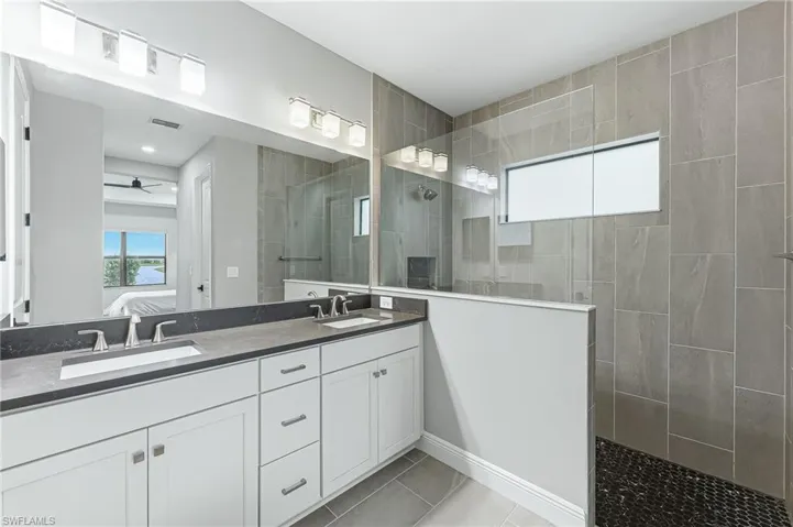 Spa-like bathroom with tall bathroom cabinetry
