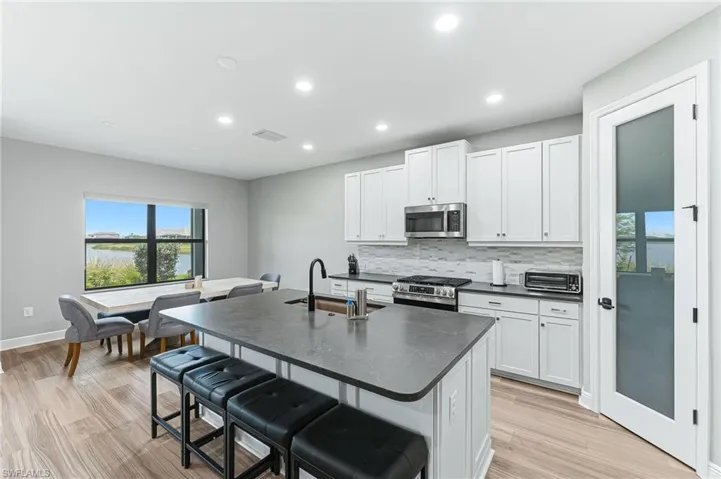 Gourmet kitchen with soft close cabinetry and walk-in pantry