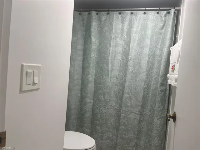 Full bath featuring a shower with curtain