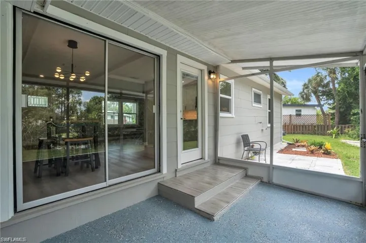 Sunroom featuring a notable chandelier and a healthy amount of sunlight