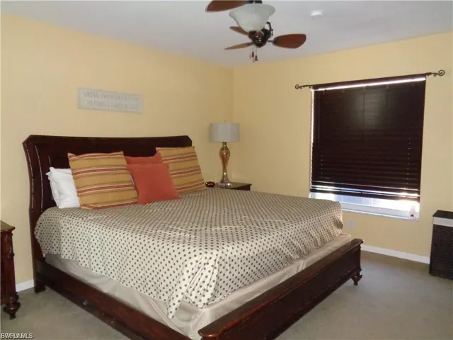 Bedroom featuring carpet floors and ceiling fan