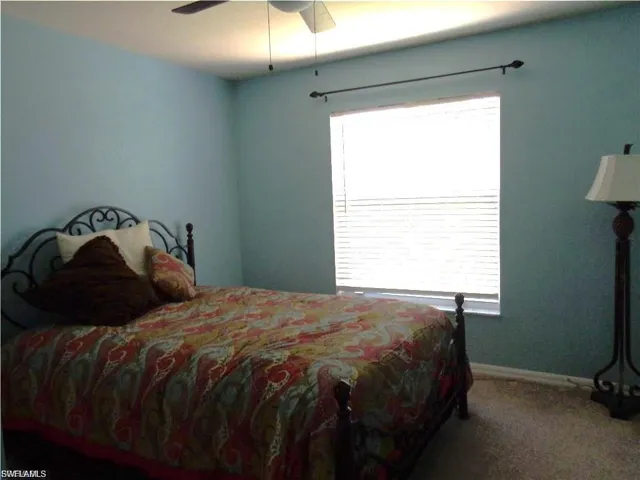 Bedroom featuring carpet and a ceiling fan