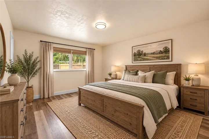 Virtually Staged Wood-finish flooring, white walls, and a prominent window with blinds and curtains
