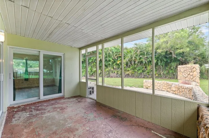 Screened-in patio with concrete flooring
