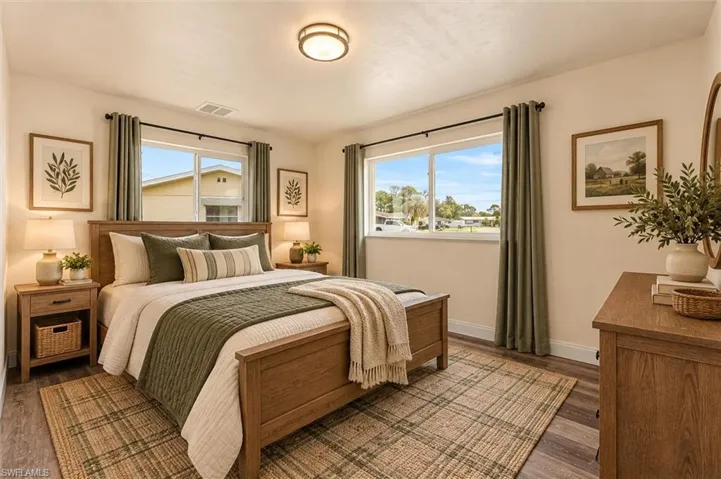 Virtually Staged Wood-finish flooring, recessed lighting, and dual windows with window treatments