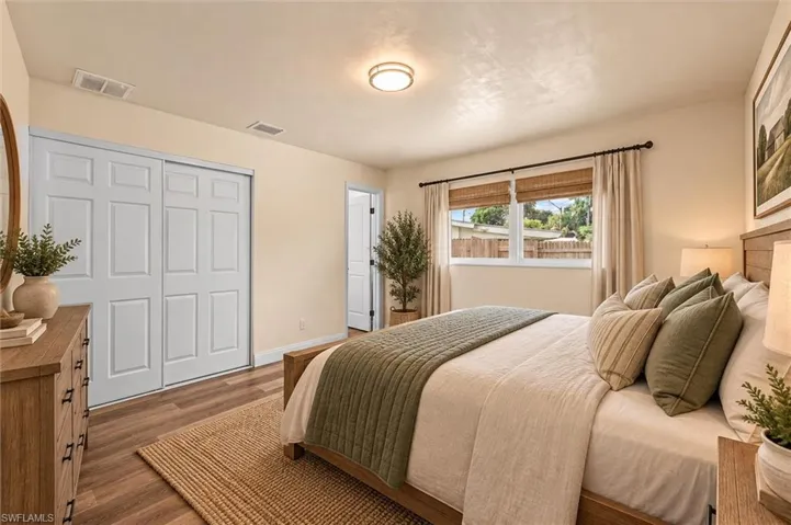 Virtually Staged Wood-finish flooring with a flush-mount ceiling light