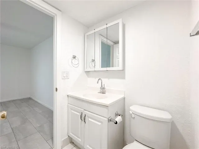 Bathroom featuring vanity and light tile patterned floors