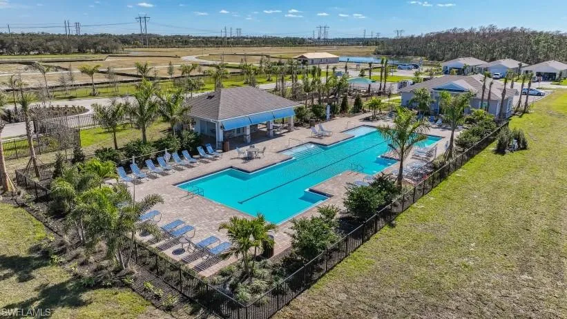 View of pool featuring a patio and a lawn