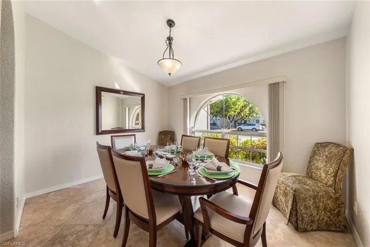 Dining space featuring vaulted ceiling
