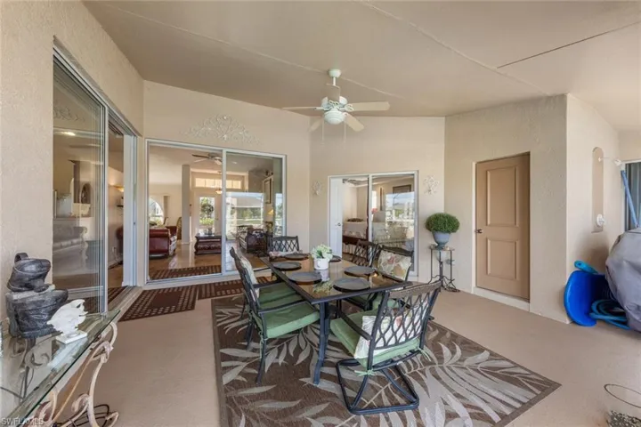 Dining room with carpet floors and ceiling fan