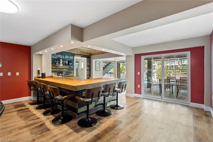 First floor entertainment room with custom bar