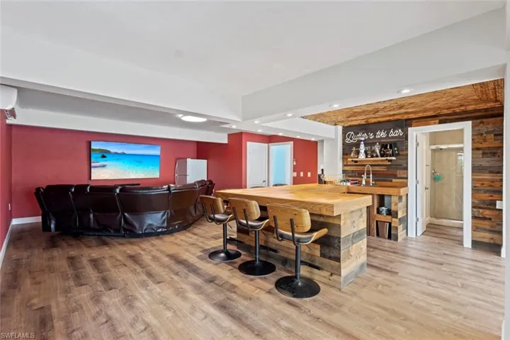 First floor entertainment room with custom bar
