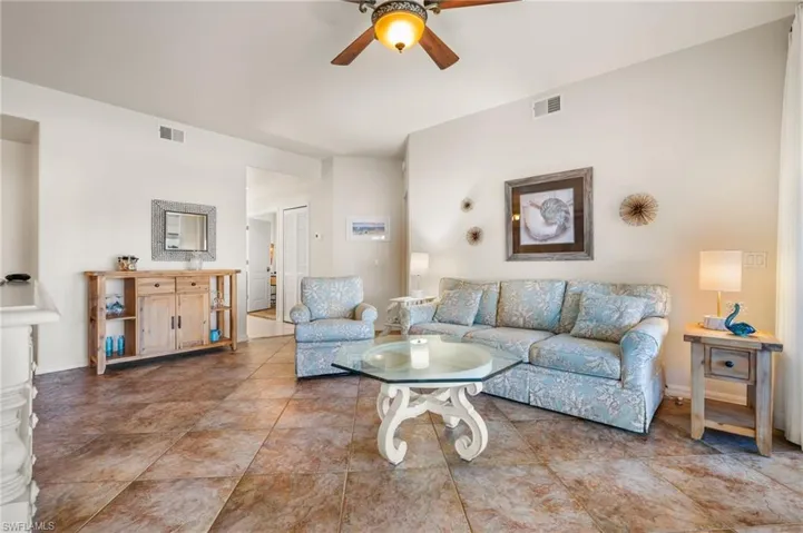 Living room featuring ceiling fan