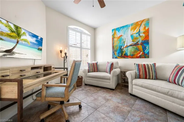 Office space featuring tile patterned flooring and ceiling fan