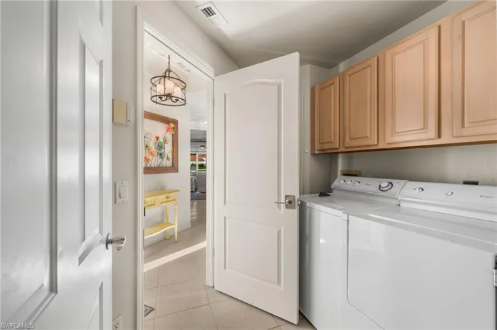 Laundry room has extra storage.