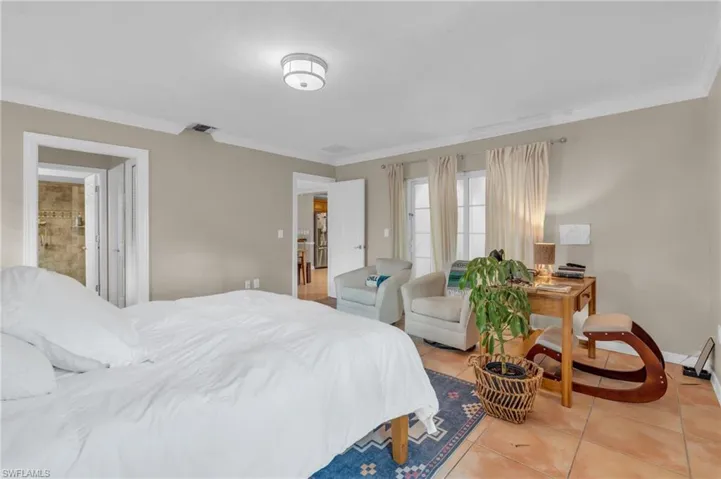 Tiled bedroom with ornamental molding
