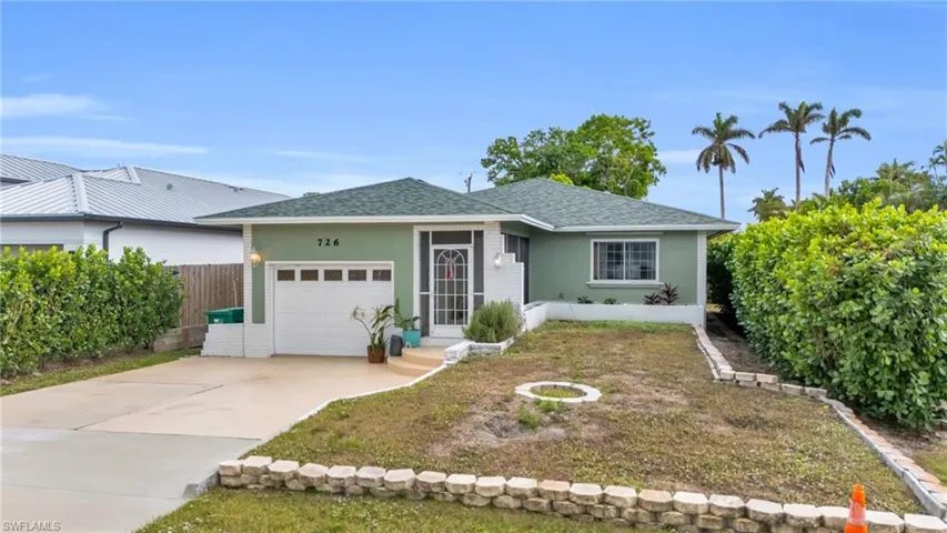 Ranch-style home with a garage