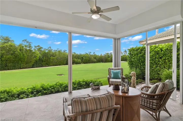 Sunroom featuring plenty of natural light and ceiling fan