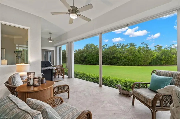 Sunroom / solarium featuring ceiling fan