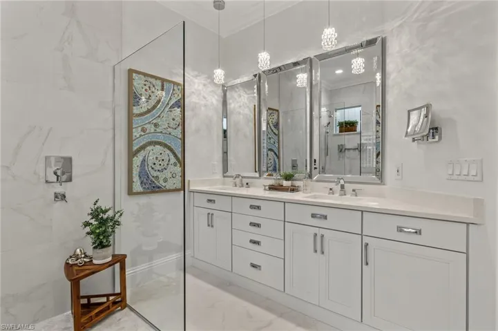 Bathroom featuring ornamental molding and vanity
