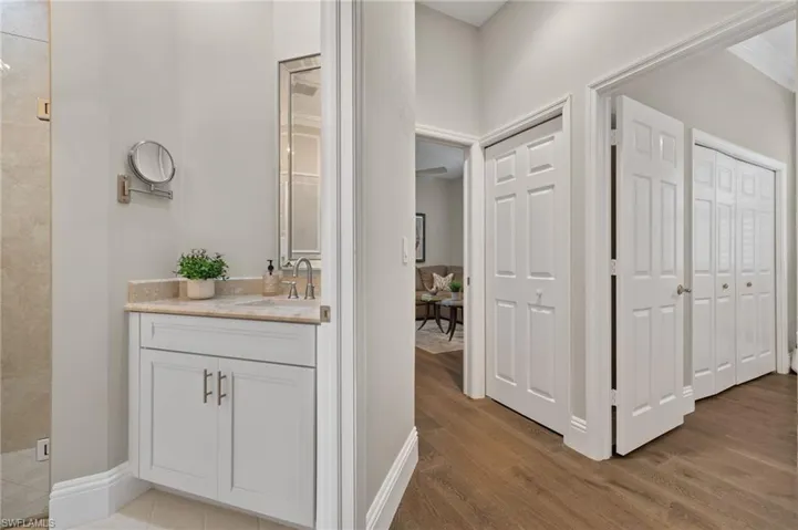 Bathroom with hardwood / wood-style floors and vanity