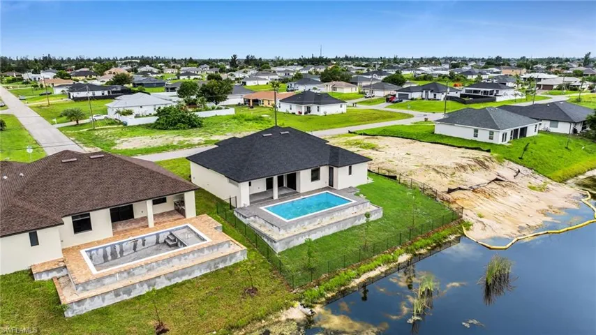 Aerial perspective of suburban area with a pool area