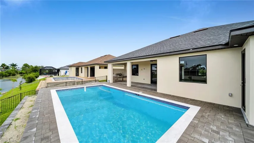 View of swimming pool featuring patio surround