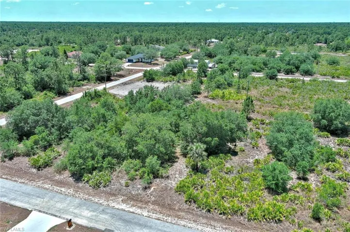 Aerial overview of property's location featuring a forest